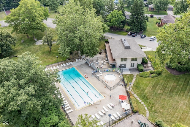 8439 Goldfinch Cir, Indianapolis, IN 46256 - view of subject property with a pool area and a tree filled landscape