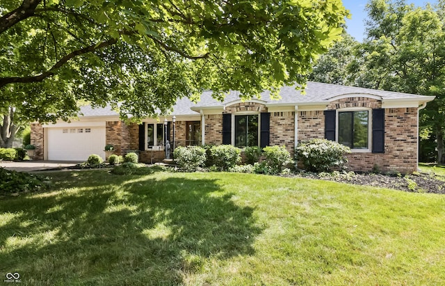 8439 Goldfinch Cir, Indianapolis, IN 46256 - ranch-style home with a garage, brick siding, a front yard, and roof with shingles