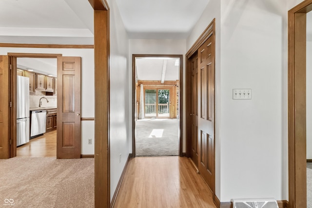 8439 Goldfinch Cir, Indianapolis, IN 46256 - hall featuring light colored carpet and light wood-style floors