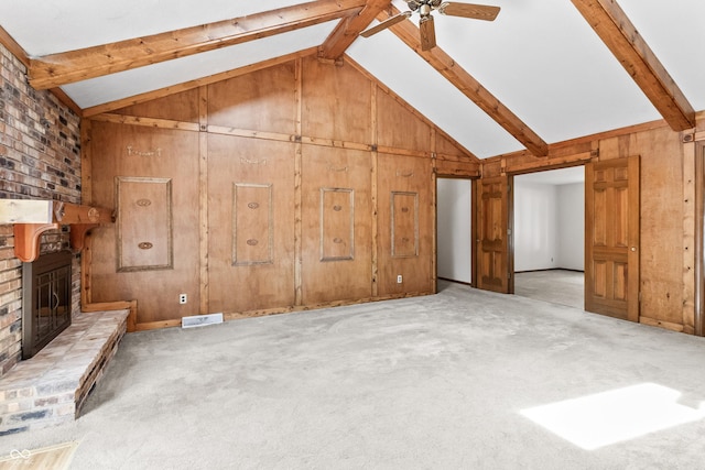 8439 Goldfinch Cir, Indianapolis, IN 46256 - unfurnished living room featuring a brick fireplace, a ceiling fan, beam ceiling, wooden walls, and carpet