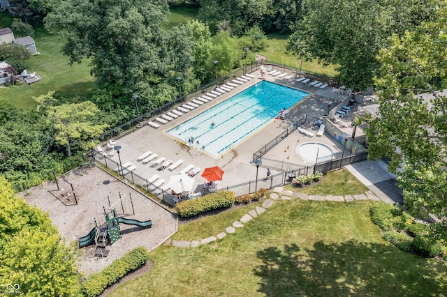 8439 Goldfinch Cir, Indianapolis, IN 46256 - bird's eye view of a pool and a tree filled landscape