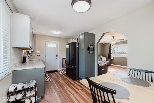 2824 E 150 S, Tipton, IN 46072 - kitchen featuring ceiling fan, light countertops, light wood-style floors, and freestanding refrigerator
