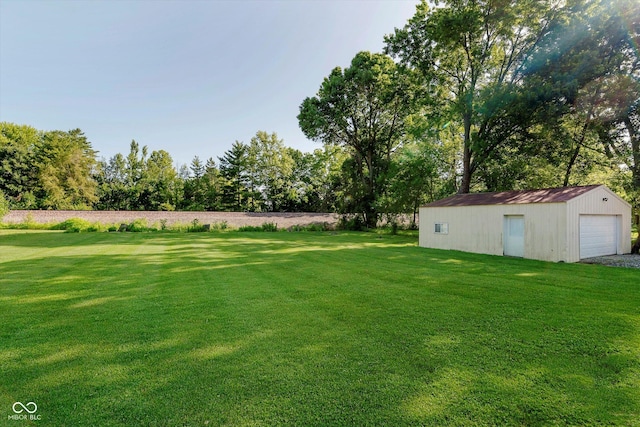2824 E 150 S, Tipton, IN 46072 - view of grassy yard with an outbuilding, a detached garage, and view of scattered trees