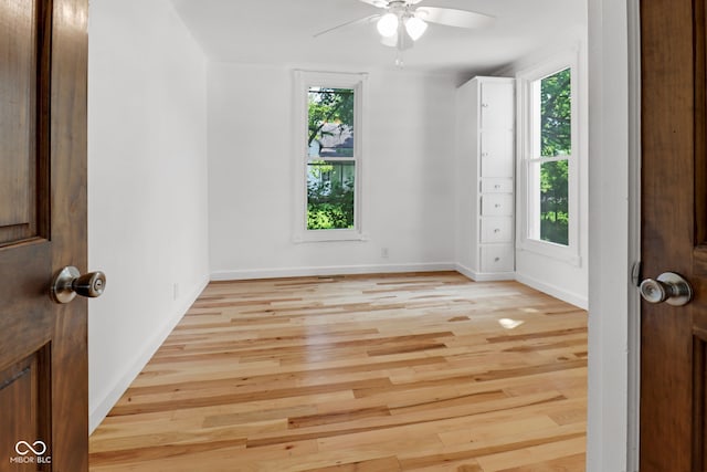 2400 Walnut St, Anderson, IN 46016 - unfurnished room with healthy amount of natural light, a ceiling fan, and light wood-style floors