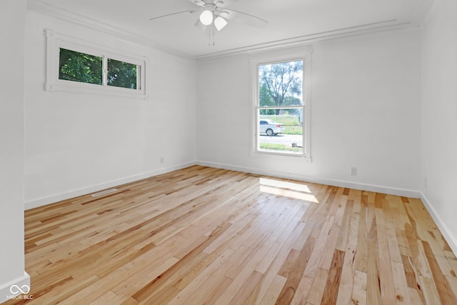2400 Walnut St, Anderson, IN 46016 - spare room with light wood finished floors, ceiling fan, and crown molding
