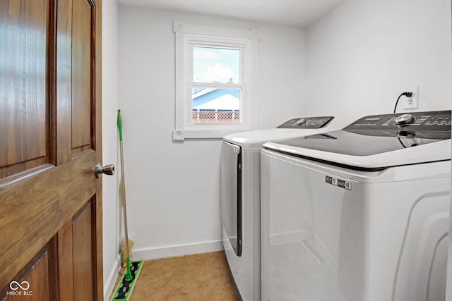 2400 Walnut St, Anderson, IN 46016 - laundry area featuring washer and dryer and light tile patterned floors