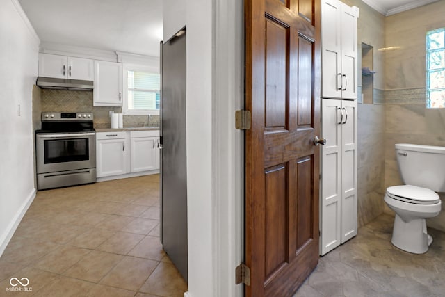 2400 Walnut St, Anderson, IN 46016 - bathroom with healthy amount of natural light, ornamental molding, tile patterned floors, tasteful backsplash, and vanity