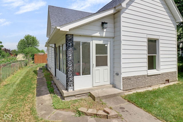 2400 Walnut St, Anderson, IN 46016 - view of side of home with roof with shingles and stone siding