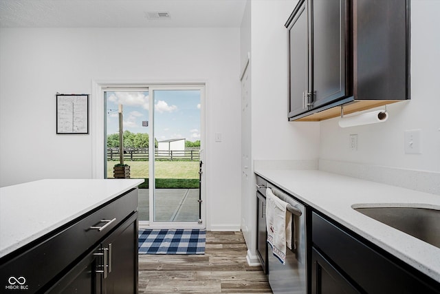 1461 Bigleaf Dr, Sheridan, IN 46069 - kitchen featuring stainless steel dishwasher and light wood-style flooring