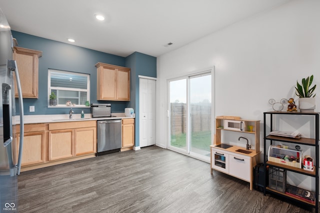 77 Winding Brook Way, Pendleton, IN 46064 - kitchen with stainless steel appliances, light brown cabinets, wood finished floors, light countertops, and recessed lighting