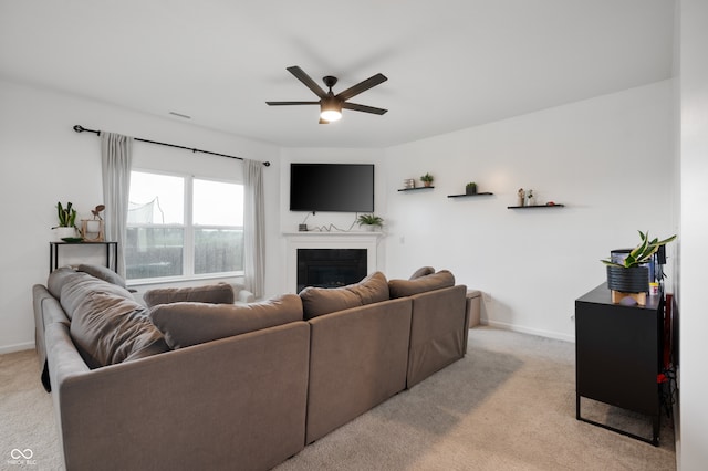 77 Winding Brook Way, Pendleton, IN 46064 - living room with light colored carpet, a ceiling fan, and a fireplace