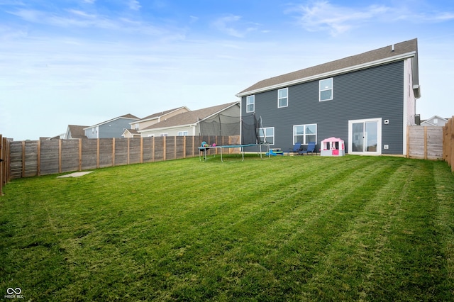 77 Winding Brook Way, Pendleton, IN 46064 - back of property with a trampoline and a fenced backyard
