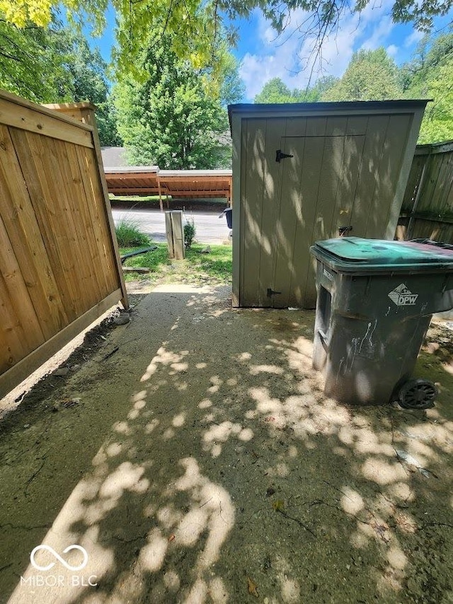 4235 Foxglove Trce, Indianapolis, IN 46237 - view of patio featuring an outbuilding