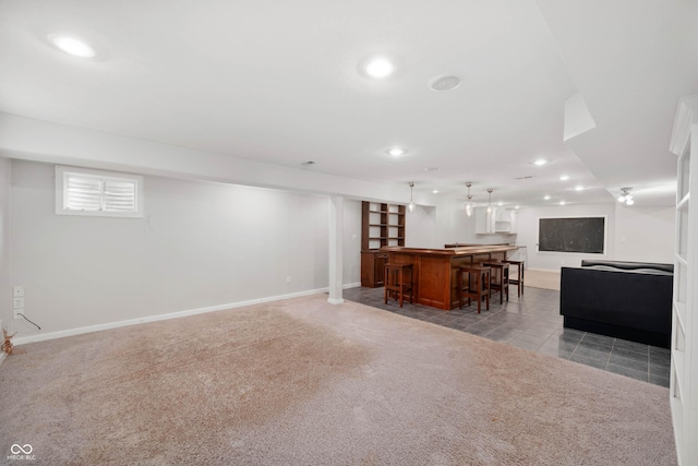 8578 Nolan Dr, Fishers, IN 46038 - living area with bar area, recessed lighting, light carpet, and light tile patterned floors
