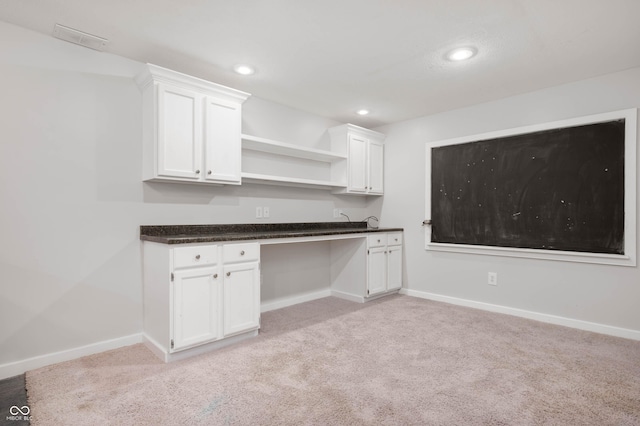 8578 Nolan Dr, Fishers, IN 46038 - kitchen featuring open shelves, white cabinets, light colored carpet, dark countertops, and recessed lighting