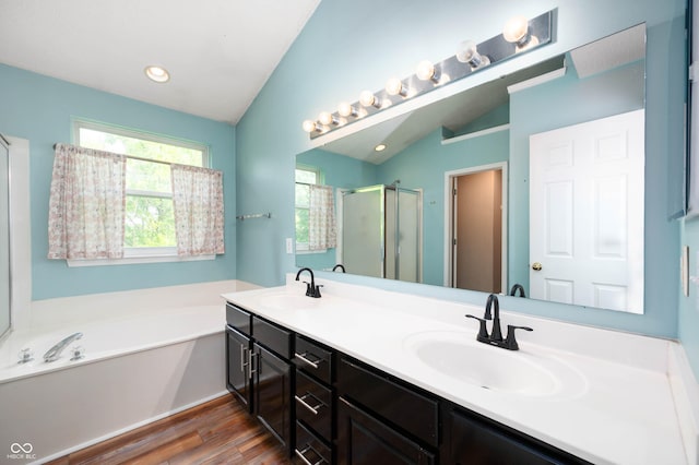 8578 Nolan Dr, Fishers, IN 46038 - full bath with a garden tub, a stall shower, double vanity, wood finished floors, and vaulted ceiling
