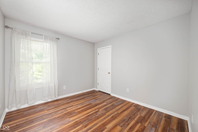 8578 Nolan Dr, Fishers, IN 46038 - spare room with wood finished floors and a textured ceiling