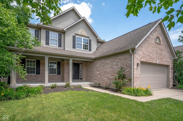 8578 Nolan Dr, Fishers, IN 46038 - view of front of property featuring covered porch, brick siding, concrete driveway, and a front yard