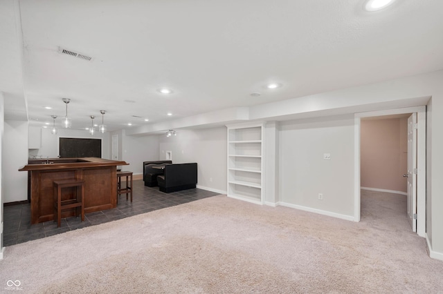 8578 Nolan Dr, Fishers, IN 46038 - carpeted living room featuring recessed lighting and bar area