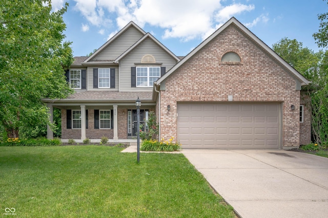 8578 Nolan Dr, Fishers, IN 46038 - view of front of property featuring driveway, a front yard, an attached garage, brick siding, and a porch