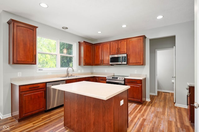 8578 Nolan Dr, Fishers, IN 46038 - kitchen with appliances with stainless steel finishes, light wood-style floors, light countertops, decorative light fixtures, and recessed lighting