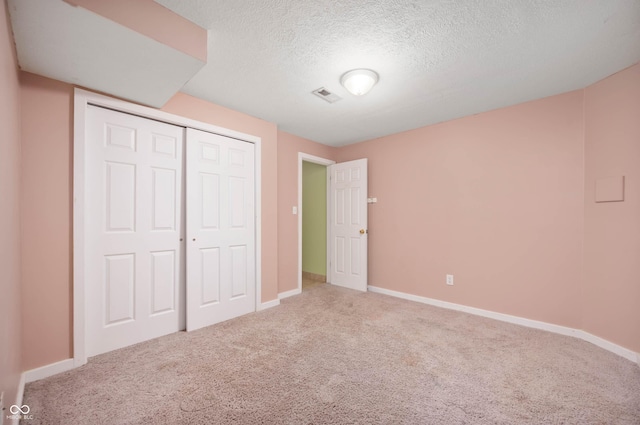 8578 Nolan Dr, Fishers, IN 46038 - unfurnished bedroom with carpet, a textured ceiling, and a closet