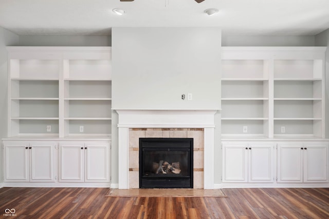 8578 Nolan Dr, Fishers, IN 46038 - unfurnished living room with ceiling fan, dark wood-style floors, and a tile fireplace