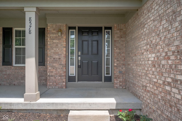 8578 Nolan Dr, Fishers, IN 46038 - entrance to property featuring brick siding and a porch