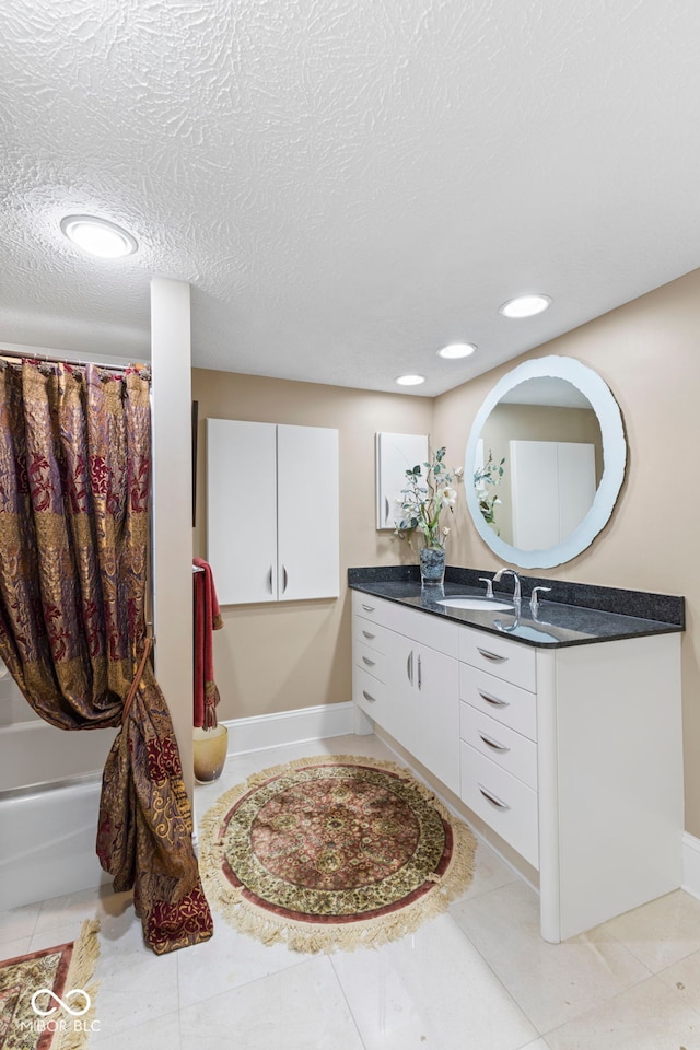 8164 Dean Rd, Indianapolis, IN 46240 - full bath featuring vanity, shower / bath combination with curtain, recessed lighting, a textured ceiling, and tile patterned floors