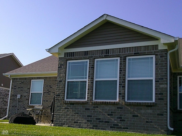 8804 Faulkner Dr, Indianapolis, IN 46239 - view of home's exterior with a patio and brick siding