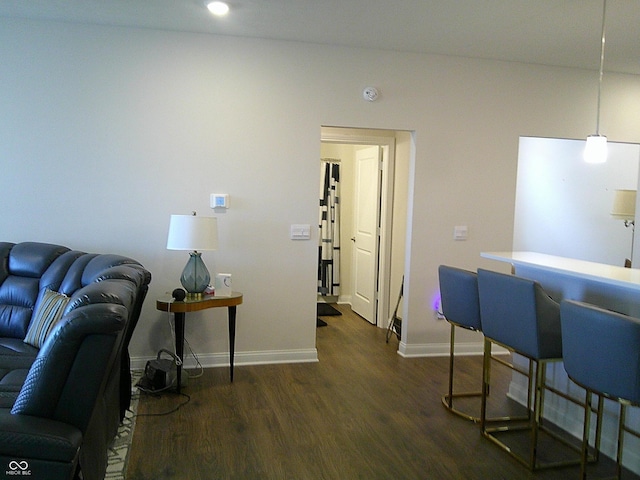 8804 Faulkner Dr, Indianapolis, IN 46239 - living room featuring dark wood finished floors and baseboards