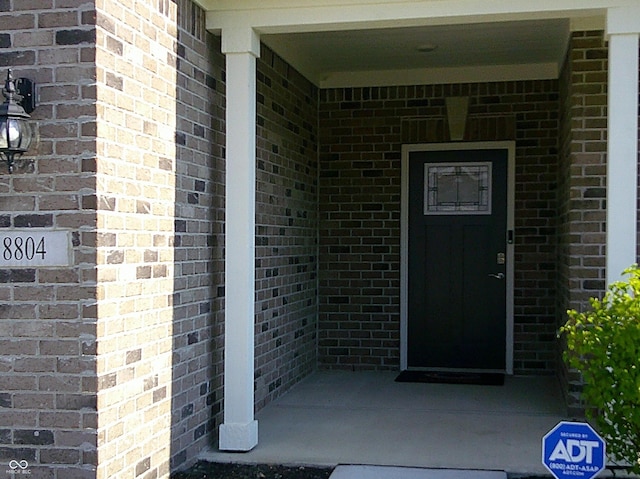 8804 Faulkner Dr, Indianapolis, IN 46239 - property entrance featuring brick siding