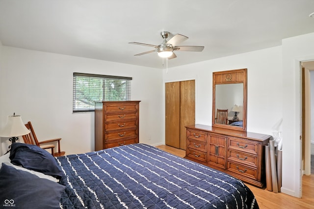 8219 Bishops Ln, Indianapolis, IN 46217 - bedroom featuring light wood-style floors, a ceiling fan, and a closet