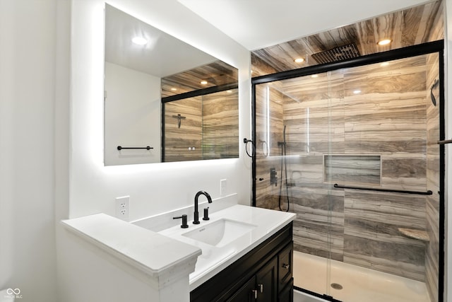 8219 Bishops Ln, Indianapolis, IN 46217 - bathroom with vanity, a stall shower, and recessed lighting