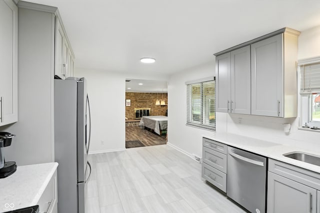8219 Bishops Ln, Indianapolis, IN 46217 - kitchen with appliances with stainless steel finishes, gray cabinetry, plenty of natural light, and recessed lighting