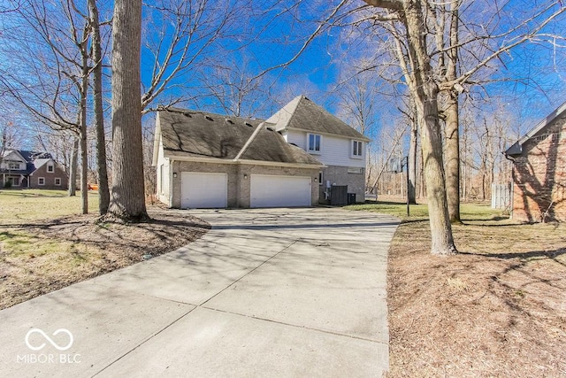 3948 S Woodfield Dr, New Palestine, IN 46163 - view of front of home with concrete driveway, brick siding, and a garage