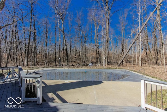 3948 S Woodfield Dr, New Palestine, IN 46163 - view of pool featuring an empty pool and a wooden deck
