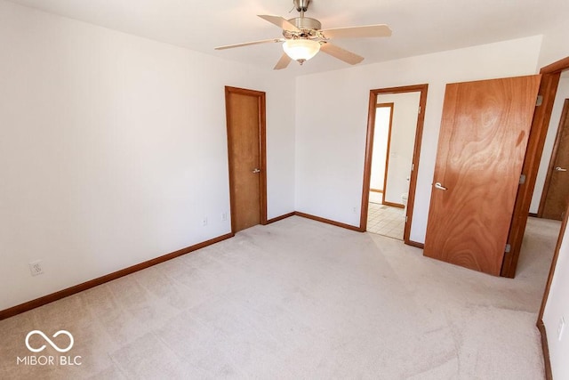 3948 S Woodfield Dr, New Palestine, IN 46163 - unfurnished bedroom with light colored carpet and a ceiling fan