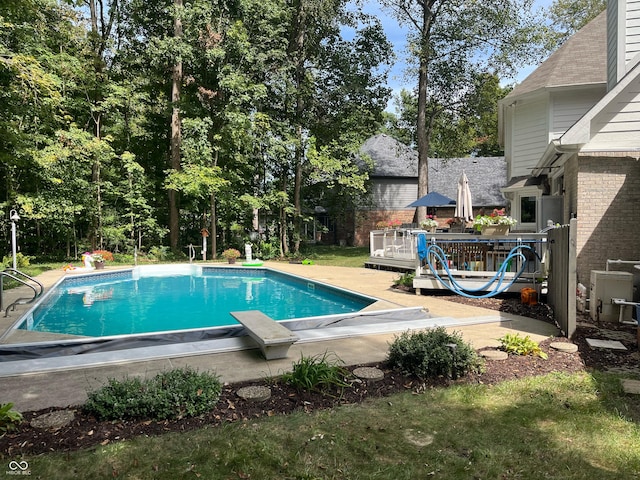 3948 S Woodfield Dr, New Palestine, IN 46163 - swimming pool featuring a wooden deck and a diving board