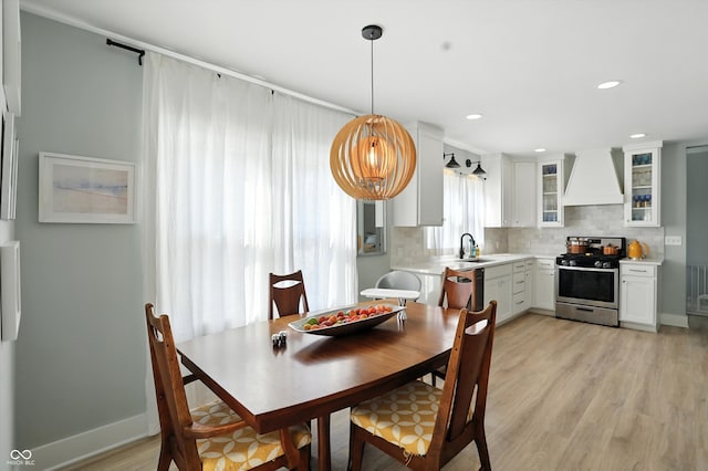 5312 Norwaldo Ave, Indianapolis, IN 46220 - dining space with light wood finished floors and recessed lighting