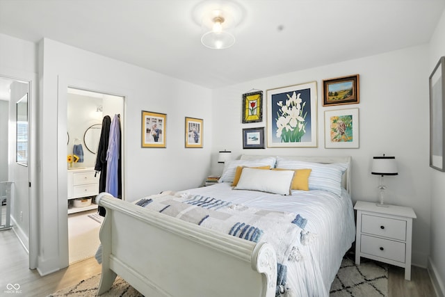 5312 Norwaldo Ave, Indianapolis, IN 46220 - bedroom with light wood-style floors and baseboards