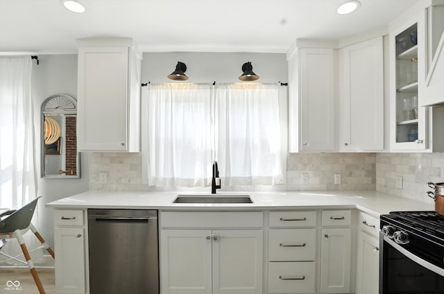 5312 Norwaldo Ave, Indianapolis, IN 46220 - kitchen with dishwasher, black range with gas stovetop, healthy amount of natural light, white cabinetry, and recessed lighting