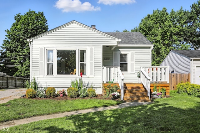 5312 Norwaldo Ave, Indianapolis, IN 46220 - bungalow-style house featuring a shingled roof and a deck