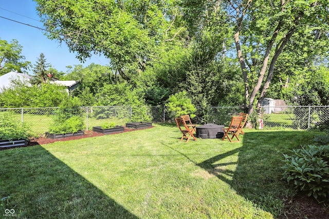 5312 Norwaldo Ave, Indianapolis, IN 46220 - fenced backyard featuring a vegetable garden