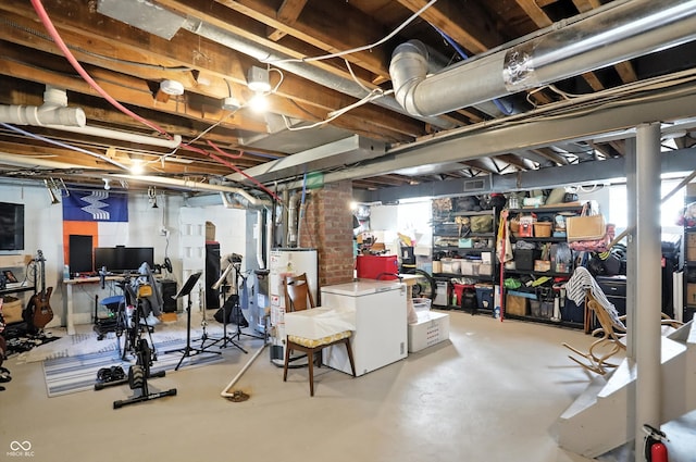 5312 Norwaldo Ave, Indianapolis, IN 46220 - below grade area featuring water heater and refrigerator