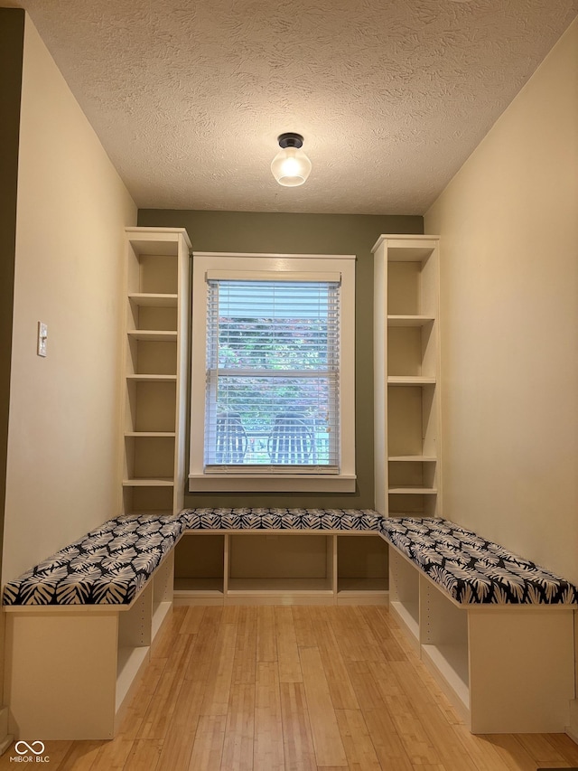 1738 E 71st St, Indianapolis, IN 46220 - mudroom featuring wood-type flooring and a textured ceiling