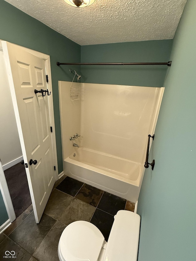 1738 E 71st St, Indianapolis, IN 46220 - bathroom with washtub / shower combination and a textured ceiling