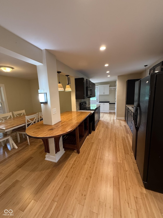 1738 E 71st St, Indianapolis, IN 46220 - dining space featuring light wood-style flooring and recessed lighting