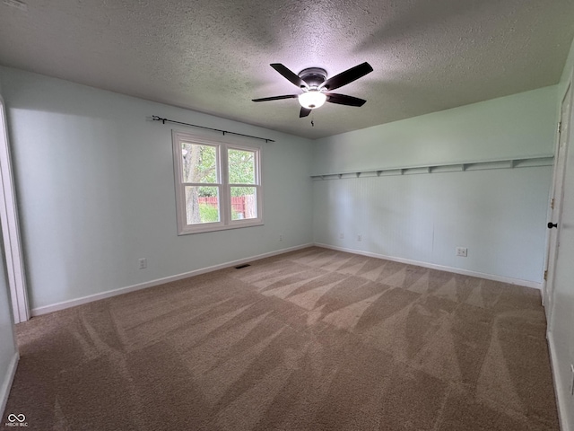 1206 Brownswood Dr, Brownsburg, IN 46112 - unfurnished room featuring a textured ceiling, light colored carpet, and ceiling fan
