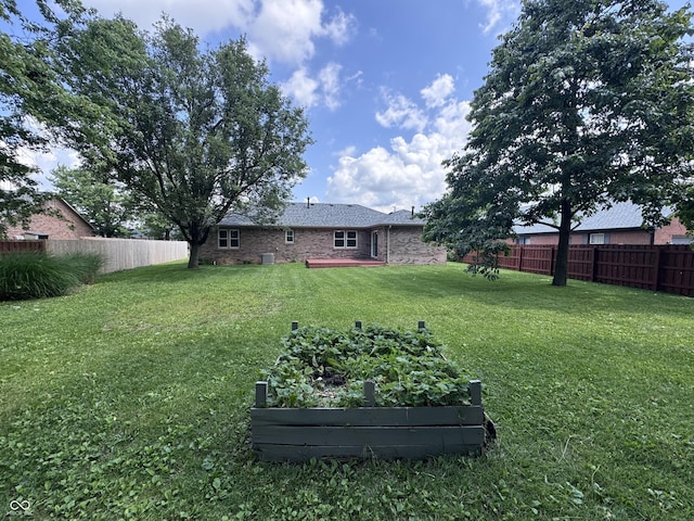 1206 Brownswood Dr, Brownsburg, IN 46112 - fenced backyard with a vegetable garden